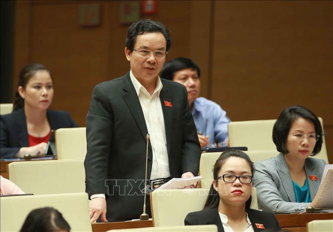 Trong ảnh: Đại biểu Quốc hội TP Hà Nội Hoàng Văn Cường chất vấn Bộ trưởng Bộ Công Thương Trần Tuấn Anh. Ảnh: Doãn Tấn - TTXVN
