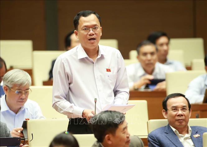 Trong ảnh: Đại biểu Quốc hội tỉnh Tây Ninh Huỳnh Thanh Phương chất vấn Bộ trưởng Bộ Công Thương Trần Tuấn Anh. Ảnh: Doãn Tấn - TTXVN