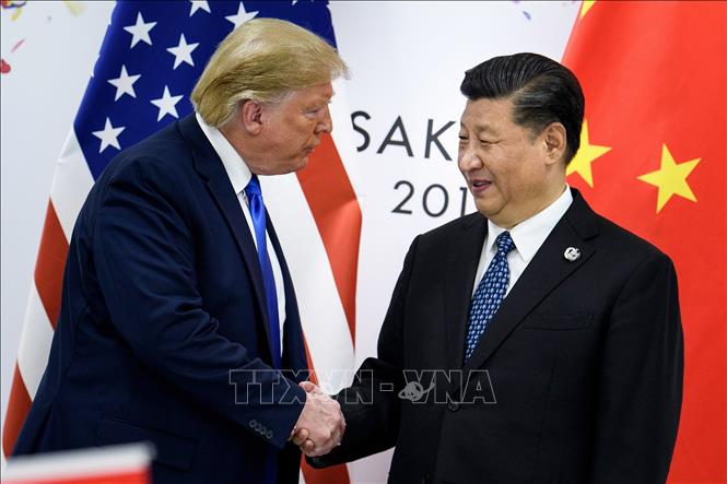 Trong ảnh: Tổng thống Mỹ Donald Trump (trái) và Chủ tịch Trung Quốc Tập Cận Bình tại cuộc gặp ở thành phố Osaka, Nhật Bản ngày 28/6/2019. Ảnh: AFP/TTXVN