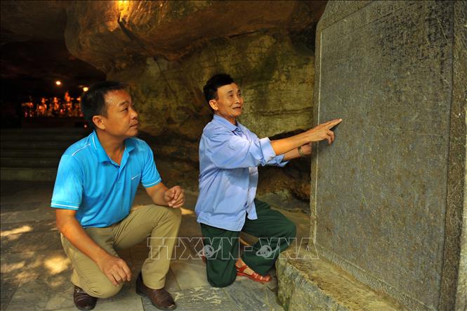 Photo: The ancient stele inside the pagoda. VNA Photo: Minh Đức