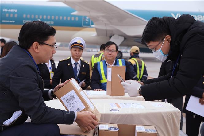 Photo: Bodies and ashes of Essex lorry victims arrive at Noi Bai international airport. VNA Photo: Lâm Khánh