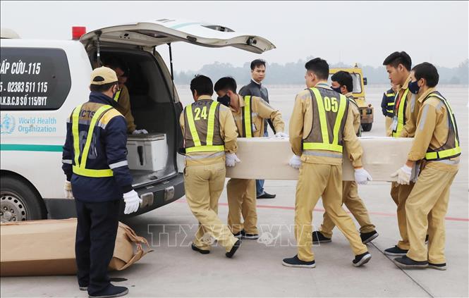 Photo: Transporting the bodies of Essex lorry victims back to their home localities. VNA Photo: Lâm Khánh