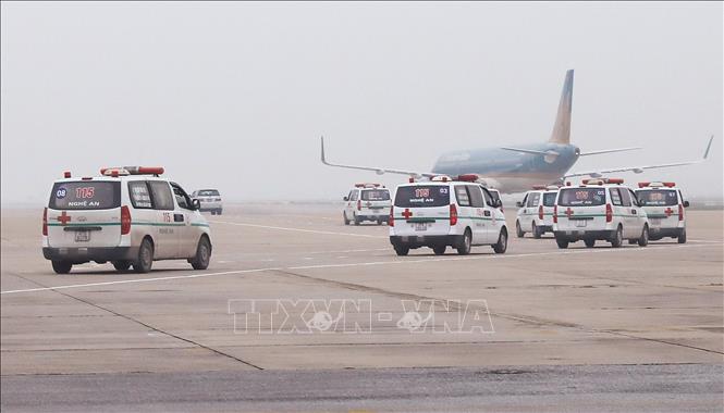 Photo: Transporting the bodies and ashes of Essex lorry victims back to their home localities. VNA Photo: Lâm Khánh