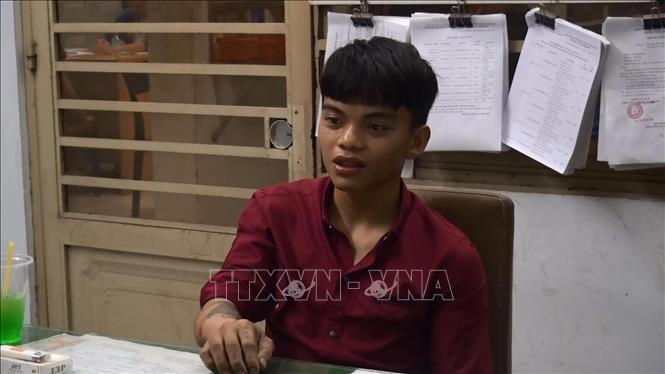 Trong ảnh: Đối tượng Nguyễn Linh Phúc tại cơ quan công an. Ảnh: Nguyễn Văn Việt - TTXVN