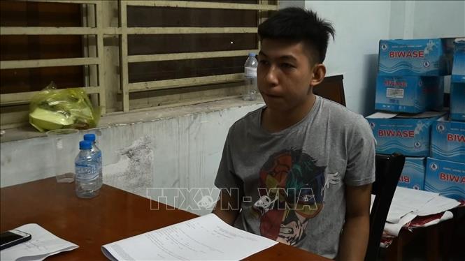 Trong ảnh: Đối tượng Nguyễn Hồ Huy Tâm tại cơ quan công an. Ảnh: Nguyễn Văn Việt - TTXVN