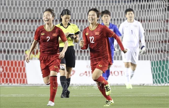 Photo: Vietnamese players celebrate their goal.  VNA Photo: Hoàng Linh