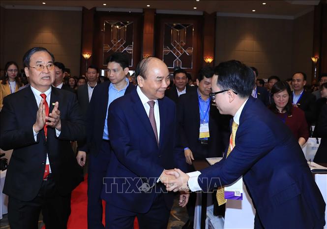 Trong ảnh: Thủ tướng Nguyễn Xuân Phúc với các đại biểu dự Lễ kỷ niệm. Ảnh: Thống Nhất – TTXVN