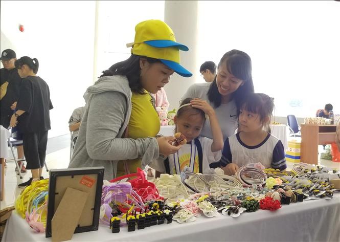 Photo: Souvenir items made by children cancer patients on sale at the event. VNA Photo: Đinh Hằng