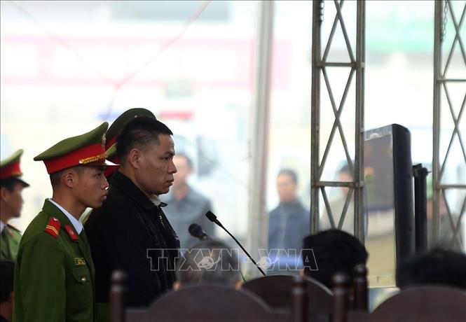 Trong ảnh: Bị cáo Vì Văn Toán trả lời trước tòa. Ảnh: Phan Tuấn Anh - TTXVN
