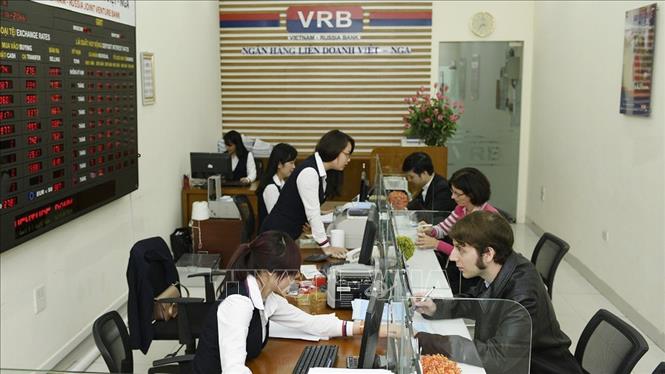 Hàng loạt thỏa thuận hợp tác Việt - Nga được ký kết những năm qua, trong chuyến thăm lẫn nhau của lãnh đạo cấp cao hai nước. Trong ảnh: Ngân hàng Liên doanh Việt – Nga (VRB) - một trong các liên doanh giữa hai nước trong lĩnh vực tài chính – ngân hàng. Ảnh: Tư liệu/TTXVN phát