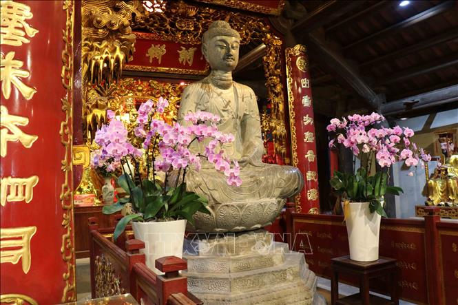 Photo: The Amitabha Buddha stone statue of thousands years old. VNA Photo: Thanh Thương