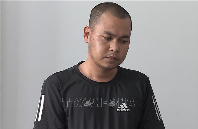 Trong ảnh: Đối tượng Trương Tài Lộc tại thời điểm bị bắt khẩn cấp. Ảnh: TTXVN phát 