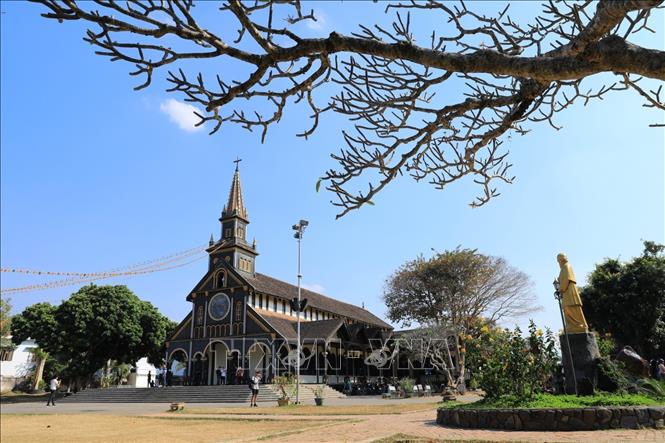 Photo: The 100-year-old church lies on the banks of Dak Bla River in the city of Kon Tum. VNA Photo: Thành Đạt