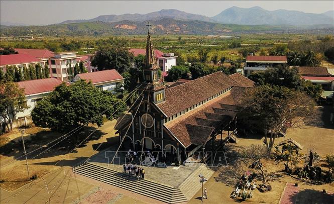 Photo: The 100-year-old church lies on the banks of Dak Bla River in the city of Kon Tum. VNA Photo: Thành Đạt