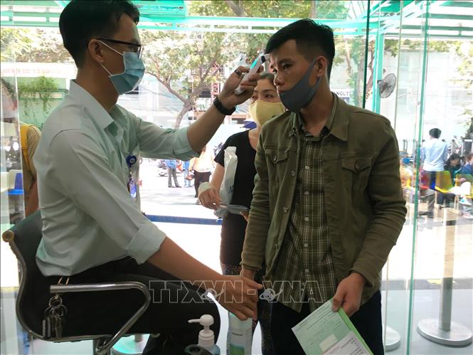 Photo: Preventive measures such as sterilisation, hand washing, body temperature measurement and facial mask use are applied at HCM City's ENT hospital. VNA Photo: Thanh Vũ