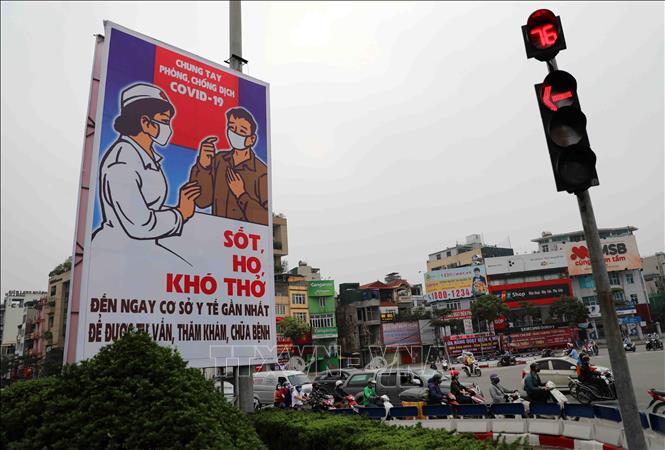 Trong ảnh: Tranh cổ động tấm lớn được đặt ở các điểm nút giao thông của Hà Nội. Ảnh: Thanh Tùng-TTXVN