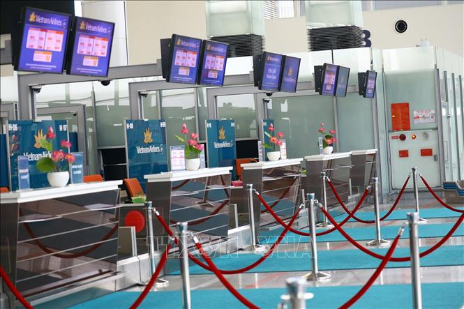 Trong ảnh: Hình ảnh quen thuộc tại nhà ga T2 sân bay Nội Bài trong thời điểm dịch. Ảnh: Huy Hùng - TTXVN