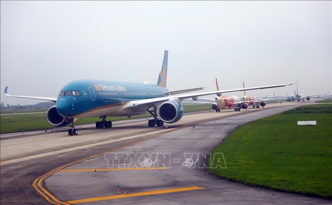 Photo: Vietnam Airlines planes at the Noi Bai International Airport in Hanoi. VNA Photo: Huy Hùng