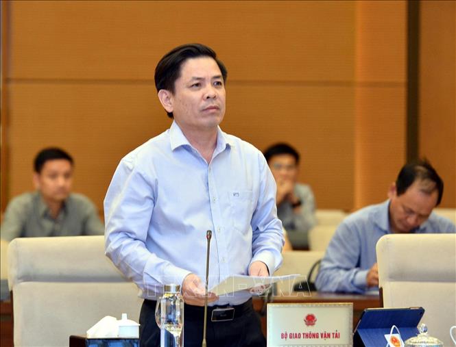 Trong ảnh: Bộ trưởng Bộ Giao thông vận tải Nguyễn Văn Thể trình bày Tờ trình. Ảnh: Trọng Đức - TTXVN
