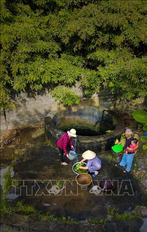 Photo: The village well provides water for the villagers’ daily use. VNA Photo: Minh Đức