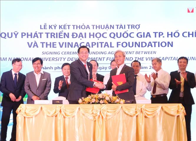 Photo: ICED signed cooperation agreement with VinaCapital. VNA Photo: Thu Hương