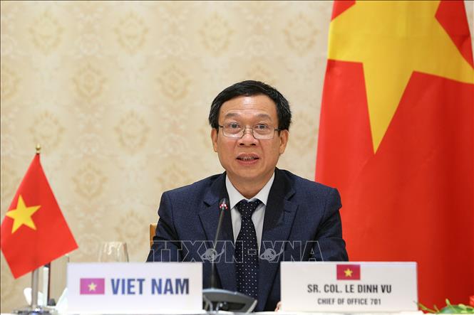 Photo: Colonel Le Dinh Vu, Head of the Office 701 speaks at the workshop in Hanoi. VNA Photo: Dương Giang
