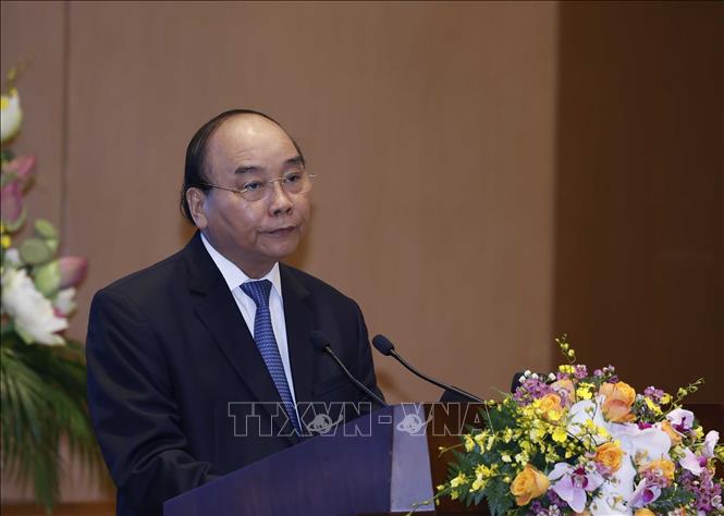 Photo: PM Xuan Phuc speaks at the video conference. VNA Photo: Thống Nhất