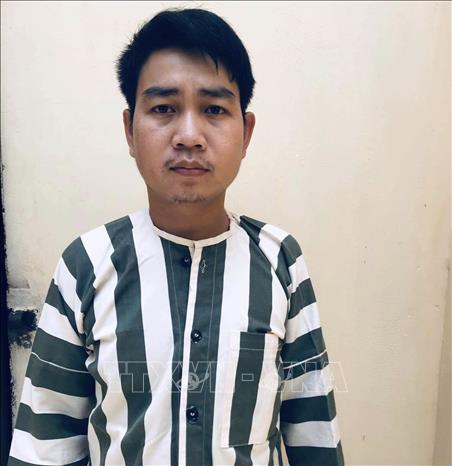 Trong ảnh: Đối tượng Trịnh Văn Trình bị bắt giữ. Ảnh: Quang Thái- TTXVN