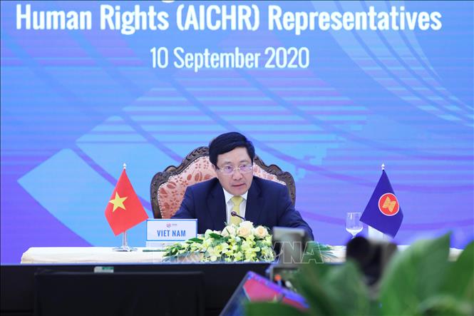 Photo: Vietnamese Deputy Prime Minister, Foreign Minister Pham Binh Minh chairs the event from Hanoi. VNA Photo: Lâm Khánh