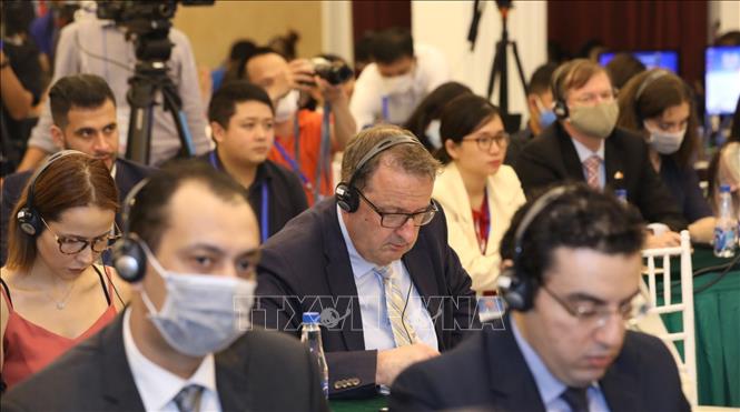 Photo: Vietnamese and international reporters at the press conference. VNA Photo
