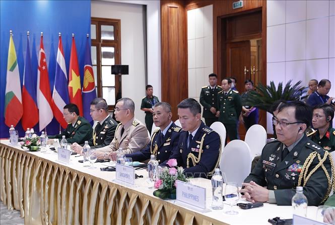 Photo: ASEAN military attaches to Vietnam at the meeting in Hanoi. VNA Photo: Dương Giang