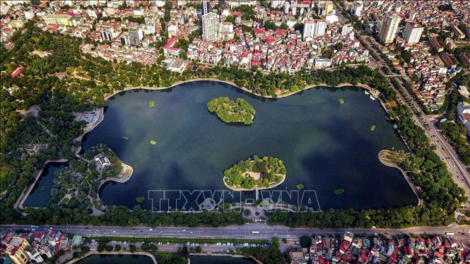 Photo: Bay Mau Lake is a renowned freshwater lake in Hanoi in Thong Nhat Park with a surface area of around 28 hectares. In the centre of the lake, there are two islands, each of which spans about 600 square metres wide.. VNA Photo: Thành Đạt