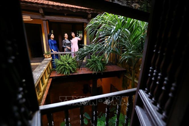 Photo: The yard is included at the centre of the building to moderate the air, provide the house with sunlight and cool winds. VNA Photo