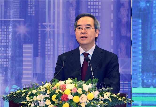 Photo: Politburo member and Head of the Party Central Committee's Economic Commission Nguyen Van Binh speaks at the summit. VNA Photo: Thống Nhất