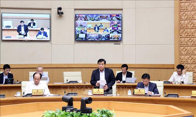 Photo: Minister of Planning and Investment Nguyen Chi Dung speaks at the video conference. VNA Photo: Thống Nhất