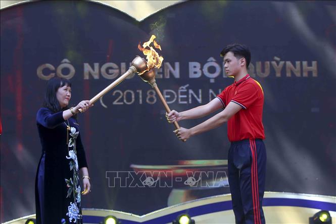 Trong ảnh: Nghi thức rước đuốc, tiếp lửa tại lễ kỷ niệm. Ảnh: Tuấn Đức - TTXVn