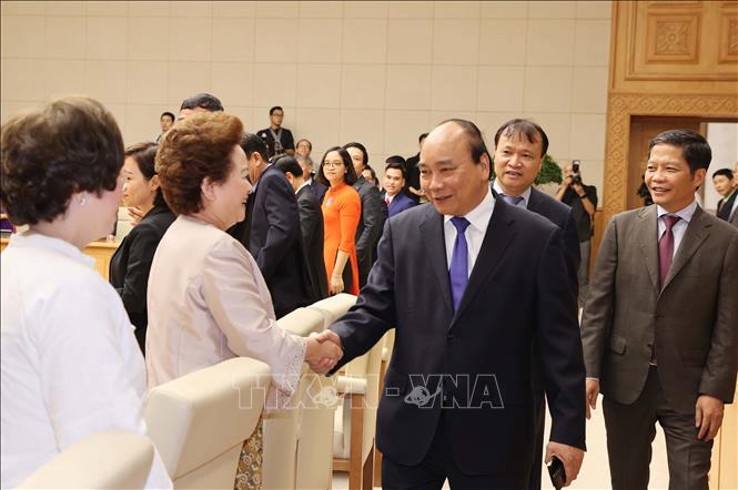 Photo: Prime Minister Nguyen Xuan Phuc meets representatives from Vietnam National Brand enterprises. VNA Photo: Thống Nhất