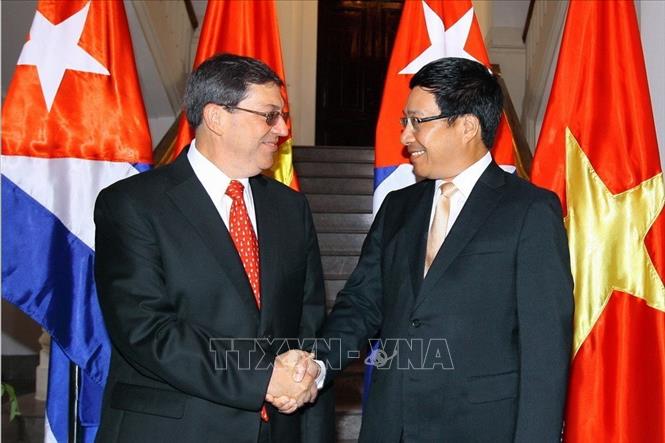 Trong ảnh: Phó Thủ tướng, Bộ trưởng Ngoại giao Phạm Bình Minh tiếp Bộ trưởng Ngoại giao Cuba Bruno Rodriguez Parrilla thăm chính thức Việt Nam, ngày 10/9/2014, tại Hà Nội. Ảnh: Thống Nhất - TTXVN