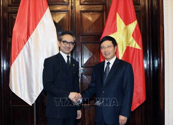 Trong ảnh: Bộ trưởng Bộ Ngoại giao Phạm Bình Minh và Bộ trưởng Bộ Ngoại giao nước Cộng hoà Indonesia, Marty Natalegawa đồng chủ trì Phiên họp lần thứ nhất Uỷ ban hợp tác song phương Việt Nam –  Indonesia (25/7/2012). Ảnh: Nguyễn Dân – TTXVN