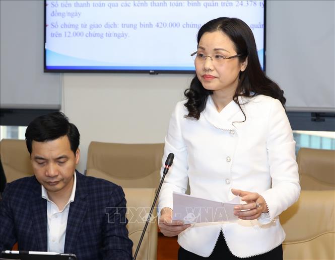 Trong ảnh: Giám đốc Kho bạc Nhà nước Hà Nội Nguyễn Thị Thanh Hương báo cáo tại buổi làm việc. Ảnh: Văn Điệp - TTXVN 
