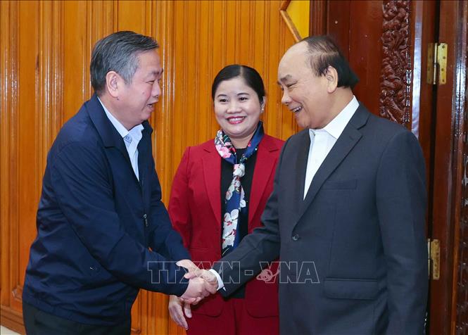 Thủ tướng Nguyễn Xuân Phúc với các cán bộ chủ chốt tỉnh Bình Phước. Ảnh: Thống Nhất – TTXVN
