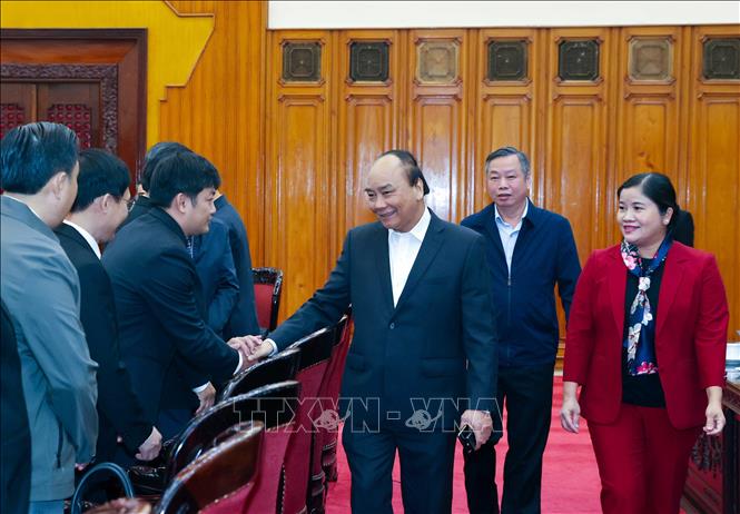 Thủ tướng Nguyễn Xuân Phúc với các cán bộ chủ chốt tỉnh Bình Phước. Ảnh: Thống Nhất – TTXVN