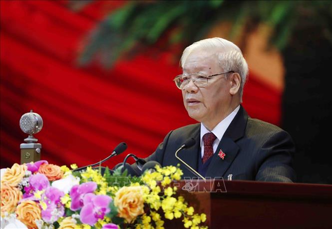 Photo: Party General Secretary and State President Nguyen Phu Trong presents the 12th Party Central Committee’s Political Report and documents to be submitted to the Congress. VNA Photo