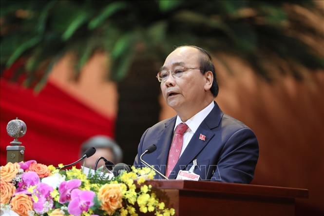Photo: Prime Minister Nguyen Xuan Phuc, on behalf of the Presidium delivers the Congress’s opening speech. VNA Photo