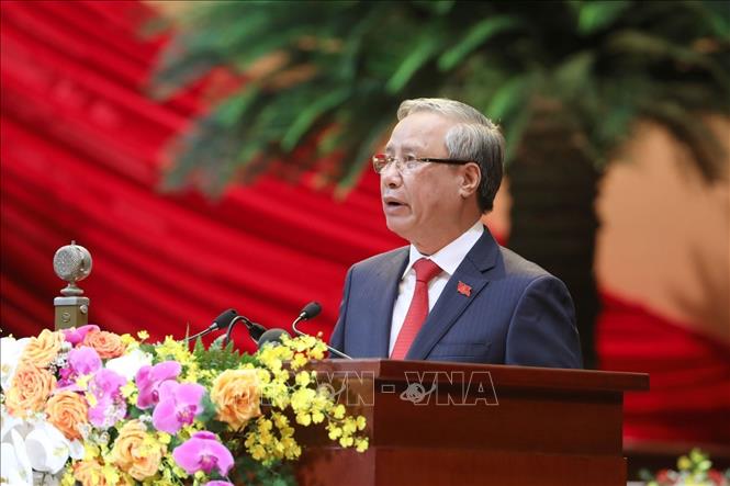 Photo: Politburo member, Standing member of the Communist Party of Vietnam Central Committee’s Secretariat Tran Quoc Vuong, on behalf of the Presidium, introduces delegates and guests of the Congress. VNA Photo 