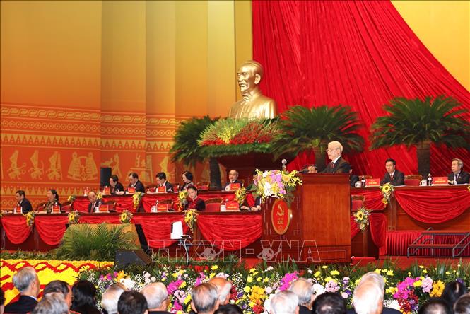 Photo: Party General Secretary and State President Nguyen Phu Trong delivers the 12th Party Central Committee’s Political Report and documents to be submitted to the Congress. VNA Photo
