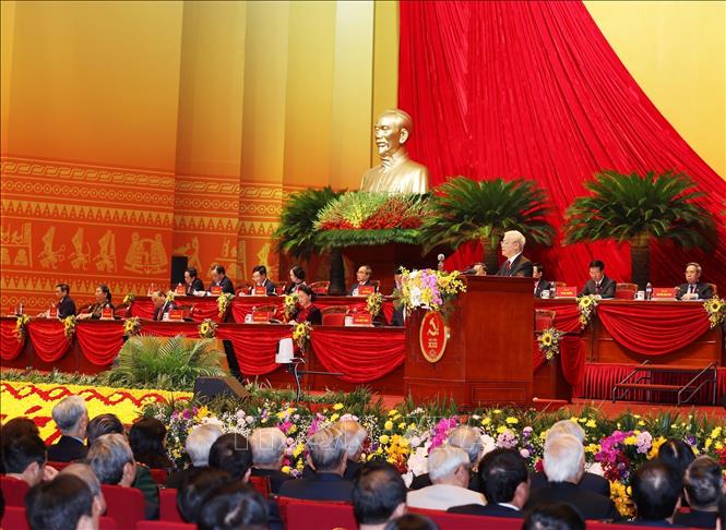 Photo: Party General Secretary and State President Nguyen Phu Trong delivers the 12th Party Central Committee’s Political Report and documents to be submitted to the Congress. VNA Photo