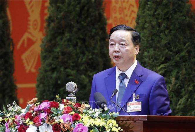 Photo: Minister of Natural Resources and Environment Tran Hong Ha, Party Central Committee member, presents a discourse. VNA Photo