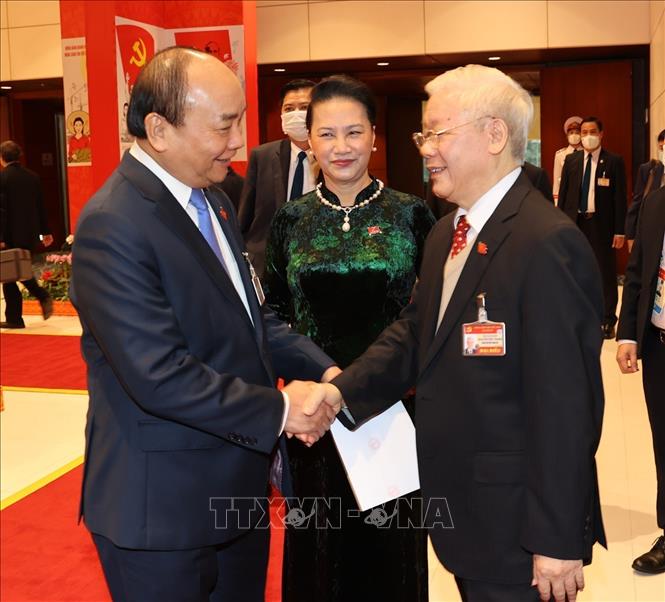 Photo: Party and State leader Nguyen Phu Trong (R), Prime Minister Nguyen Xuan Phuc (L) and National Assembly Chairwoman Nguyen Thi Kim Ngan attend the congress on January 28. VNA Photo