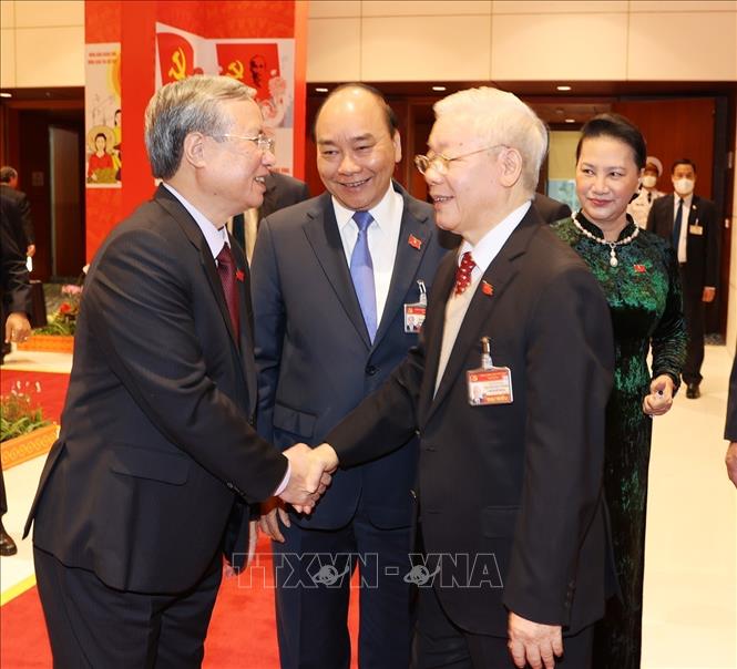 Photo: Party and State leader Nguyen Phu Trong (R) and Standing Secretariat of the Party Central Committee Tran Quoc Vuong meet on the sidelines of the congress on January 28. VNA Photo